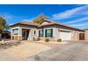 Charming single Gathering home with tile roof, stone accents, and low maintenance desert landscaping at 3426 E Elgin St, Gilbert, AZ 85295