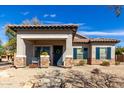 Charming home with a tile roof, stone accents, a welcoming porch, and well-maintained landscaping at 3426 E Elgin St, Gilbert, AZ 85295