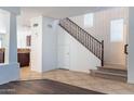 Spacious foyer with tile flooring and staircase to upper level at 35005 N 30Th Dr, Phoenix, AZ 85086