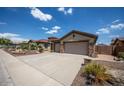 Charming home boasting a spacious three-car garage and well-maintained landscaping at 41607 N Club Pointe Dr, Phoenix, AZ 85086