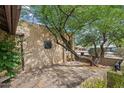 Charming courtyard space with brick accents and mature trees providing ample shade at 7226 E Virginia Ave, Scottsdale, AZ 85257