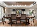 Elegant dining room with stylish seating, modern lighting, and beautiful decor at 8541 N Farview Dr, Scottsdale, AZ 85258
