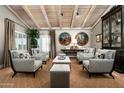 Spacious living area with hardwood floors, ample seating, and bright natural light at 8541 N Farview Dr, Scottsdale, AZ 85258