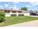 Welcoming home featuring a lush green lawn and convenient attached garage at 10408 N 105Th Ave, Sun City, AZ 85351