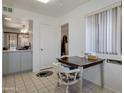 Bright eating area next to the kitchen with a view to the living room at 10408 N 105Th Ave, Sun City, AZ 85351