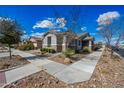 Well-maintained home with neat landscaping, decorative stone accents, and a welcoming facade under a bright sky at 10726 E Tallahassee Ave, Mesa, AZ 85212