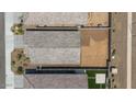 Aerial view of the property showcasing the roof, backyard, and landscaping at 13171 W Buckskin Trl, Peoria, AZ 85383