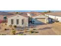 Charming home featuring a tile roof, neutral stucco, and well-maintained desert landscaping at 14562 W Georgia Ave, Litchfield Park, AZ 85340