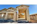 View of a home under construction, framing of the structure is well-defined at 15769 W Cheryl Dr, Waddell, AZ 85355