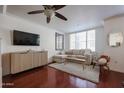 Bright living room with hardwood floors, modern ceiling fan and stylish furnishings at 1701 E Colter St # 10, Phoenix, AZ 85016