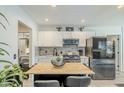 Modern kitchen with white cabinets, woodblock countertops, and stainless steel appliances at 1926 W Holly St, Phoenix, AZ 85009