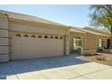 Inviting single-story home with desert landscaping, two-car garage, and tile roof at 2101 S Yellow Wood -- # 92, Mesa, AZ 85209