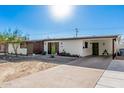 Inviting single-story home featuring covered parking and a green front door at 2324 N 40Th St, Phoenix, AZ 85008