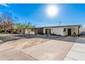 Attractive single-story home with desert landscaping, covered parking, and a bright green door at 2324 N 40Th St, Phoenix, AZ 85008