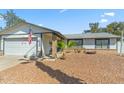 Inviting single-story home featuring a desert landscaped yard and a two-car garage at 2920 E Villa Maria Dr, Phoenix, AZ 85032
