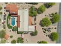 An aerial view showcases a home with a backyard pool, pristine landscaping, and paver driveway at 4726 E Sierra Vista Dr, Paradise Valley, AZ 85253