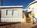 Cozy home featuring a wooden deck and stairs leading to the entrance at 538 S 98Th St, Mesa, AZ 85208