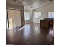 Bright living room with wood floors, high ceilings, and lots of natural light from multiple windows at 6531 W Hess S St, Phoenix, AZ 85043