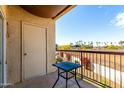 Cozy outdoor balcony with desert views and a black metal table at 7101 W Beardsley Rd # 722, Glendale, AZ 85308