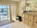Well-lit foyer featuring a mirrored accent cabinet and a glass door, providing an inviting entrance at 7750 E Broadway Rd # 814, Mesa, AZ 85208