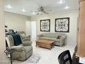 Comfortable living room with a ceiling fan and tile flooring, offering a relaxing atmosphere at 7750 E Broadway Rd # 814, Mesa, AZ 85208