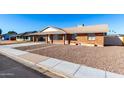 Picture of a well-maintained single-story brick home with a convenient carport and tidy landscaping at 1322 S Oracle --, Mesa, AZ 85204