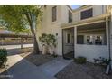 Home exterior featuring stucco, gated courtyard, covered parking, and desert landscaping at 15801 N 29Th St # 11, Phoenix, AZ 85032