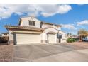 Home with a large driveway, a private gated entrance and a convenient three-car garage at 16918 W Statler St, Surprise, AZ 85388
