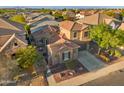 Aerial view of a desert home showcasing a tile roof, solar panels, and desert landscaping at 2134 E Honeysuckle Pl, Chandler, AZ 85286