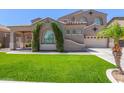Stylish single Gathering house with desert landscaping, large window, and attached two car garage at 2453 E Ebony Dr, Chandler, AZ 85286