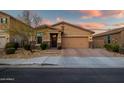 Charming single-story home with a two car garage and desert landscaping at 3010 W Laredo Ln, Phoenix, AZ 85085