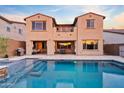 Stunning backyard with a sparkling pool, covered patio, and outdoor seating area, perfect for entertaining at 31106 N 138Th Ave, Peoria, AZ 85383