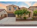 Charming two-story home with a well-manicured lawn and a convenient two-car garage at 31106 N 138Th Ave, Peoria, AZ 85383