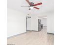 Bright living room features laminate wood floors, modern ceiling fan and fresh paint at 3227 E Enid Ave, Mesa, AZ 85204