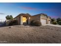 Charming single-story home with desert landscaping and a two-car garage on a sunny day at 44922 W Alamendras St, Maricopa, AZ 85139