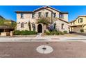 Inviting two-story stucco home with manicured front yard and decorative architectural details at 4744 E Tierra Buena Ln, Phoenix, AZ 85032