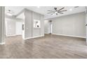 Open living room features wood tile flooring, neutral paint, and recessed lighting at 7006 E Jensen St # 33, Mesa, AZ 85207