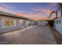Expansive backyard with a stamped concrete patio, offering privacy and an excellent space for outdoor living at 7538 E Forge Ave, Mesa, AZ 85208