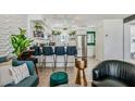 Modern kitchen featuring bar seating, white cabinets, stainless steel appliances, and stylish decor at 7601 E 2Nd St # 20, Scottsdale, AZ 85251
