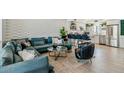 Open-concept living area with stylish decor, a cozy sectional, bar seating, and easy access to the kitchen at 7601 E 2Nd St # 20, Scottsdale, AZ 85251