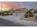Side view of the beige two-story house showing the three car garage at 802 N Butte Ave, Chandler, AZ 85226