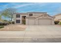 Charming two-story home featuring a three car garage, desert landscaping, and tile roof at 802 N Butte Ave, Chandler, AZ 85226