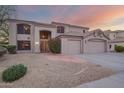 Charming two-story home featuring a three car garage and desert landscaping at 802 N Butte Ave, Chandler, AZ 85226
