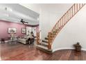 The living room leads to a curved staircase with wood banister at 802 N Butte Ave, Chandler, AZ 85226