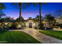 Beautiful single story home with mature trees and manicured lawn leading to a grand entrance at 8306 N Merion Way, Paradise Valley, AZ 85253