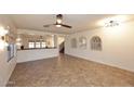 Spacious living room featuring tile floors, neutral walls, and ample natural light at 1293 E Clifton Ave, Gilbert, AZ 85295