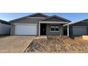 Charming single-story home with a two-car garage and low-maintenance landscaping at 15764 W Beryl Ave, Waddell, AZ 85355