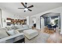 Inviting living room featuring an oversized sofa, hardwood floors, and an open floor plan at 1605 W Molly Ln, Phoenix, AZ 85085