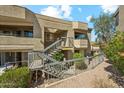 Condominium exterior showcasing well-maintained landscaping and convenient access to the unit at 1720 E Thunderbird Rd # 2078, Phoenix, AZ 85022