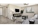 Inviting living room boasts a ceiling fan, area rug, and comfortable seating area at 1783 W Homestead Dr, Chandler, AZ 85286